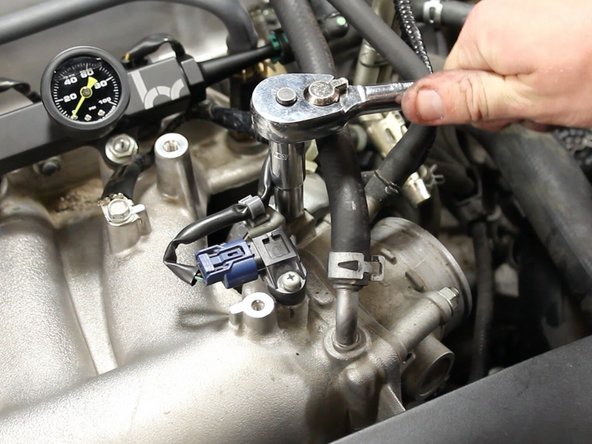 Remove the 10mm bolt mounting the MAP sensor harness mounting bracket.