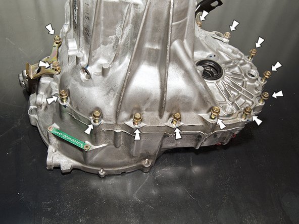 Using a 12mm socket, remove all of the 8mm flange bolts that hold the two halvs of the tranmsission together.