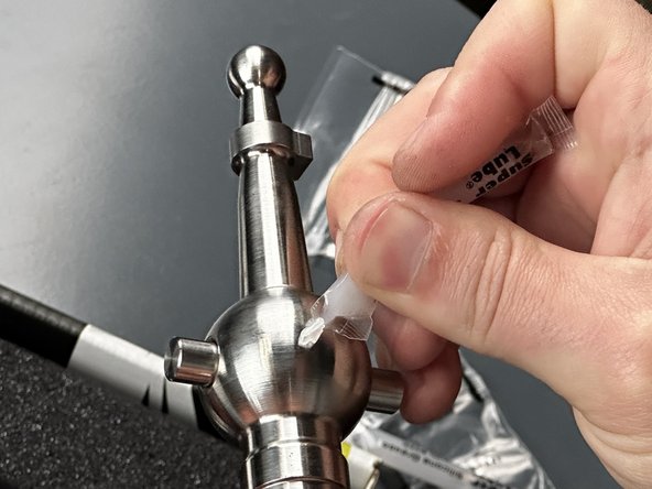 Locate the Shifter Main Rod (#4) in the package as well as a pack of grease.