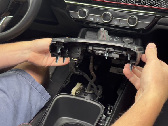 Lift the cover up to gain access to the wiring and connectors underneath.