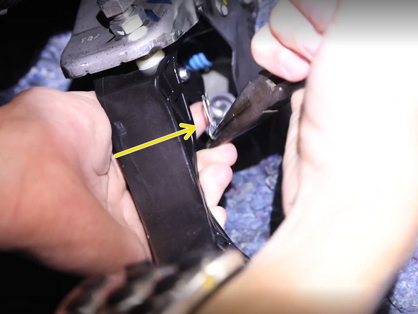 Inside of the car, remove the retaining clip at the pedal.