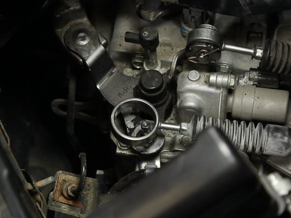 Pry the remaining rubber bushing out of the cable end.