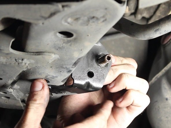 Prepare the removal of the 14mm nut with penetrating oil for easy removal. Use an Allen wrench to keep the end link from turning as you loosen the nut.