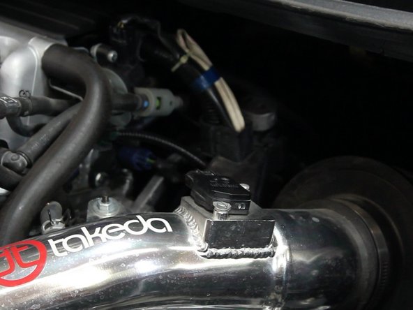 Unplug the MAF sensor and remove any bolts holding the top section of the intake in place.