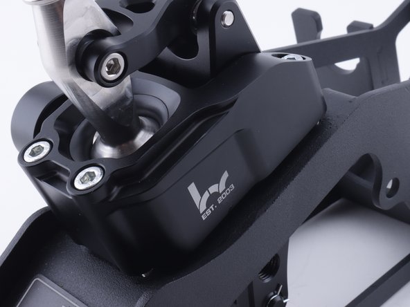 Once the spring is in place and the bolts are tightened confirm there is no gap between the housing and the base.