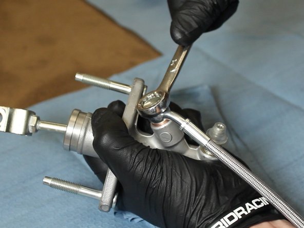 Tighten the banjo fitting. (8-10 ft•lbs)