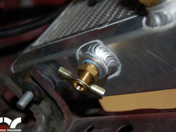 Install the drain bolt. Thread sealer can be used if desired.