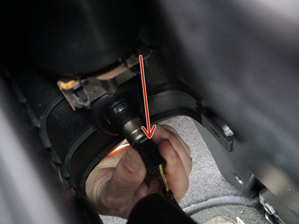 Lift the rear section of the console up and unplug the rear 12v connector.