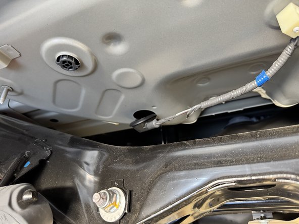 Pull down the factory wiring grommet and insert the  HR exhaust valve wiring harness.