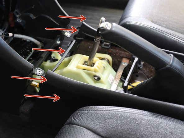 Slide the console backwards. Make sure nothing is still connected.