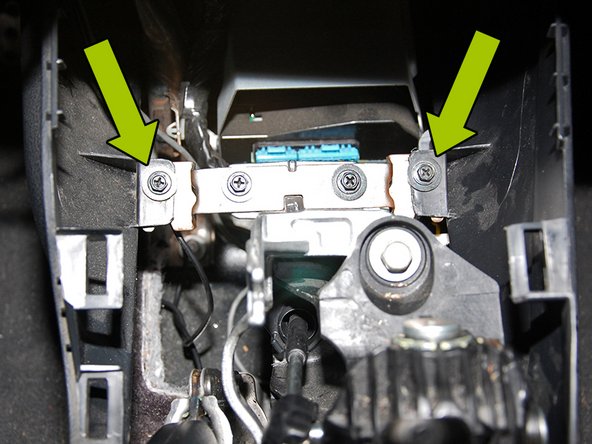 Next you will need to use your 8mm nut driver to remove the (4) bolts that hold the center console down.