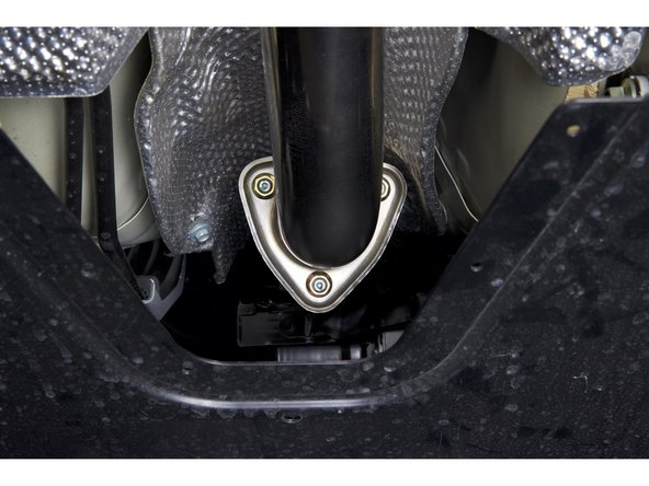 Use the supplied hardware and install the front pipe adapter.