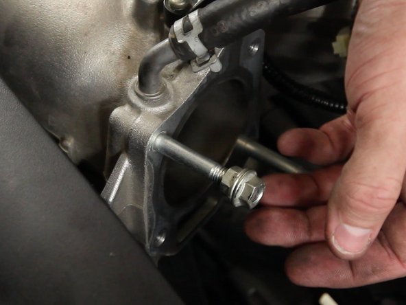 Next you will need to remove the studs from the throttle body port on the intake manifold.