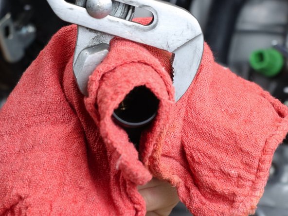 You can use a 1 1/2&quot; adjustable wrench, large AN wrench or a pair of adjustable pliers. We show the most common method since these tools are commonly found.