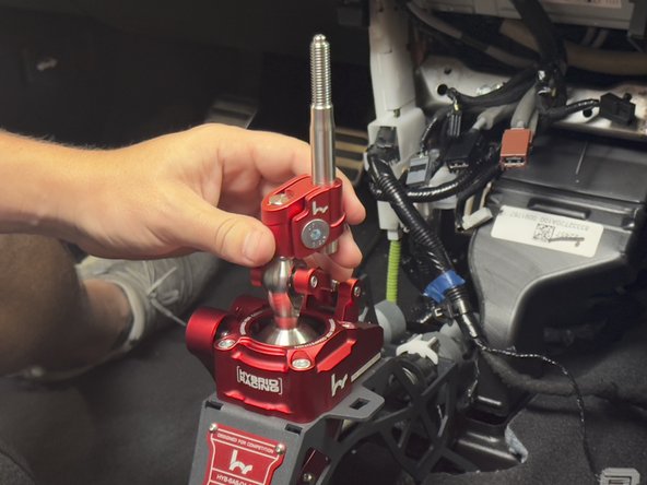 Install the supplied shifter offset and rod.