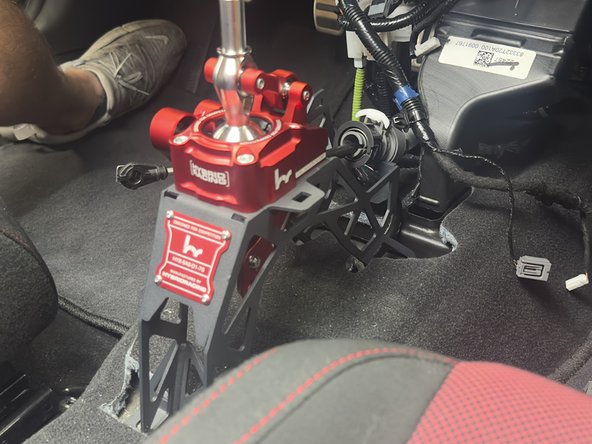 Install the Hybrid Racing shifter using the OEM hardware.