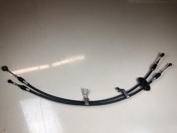 A completed set of Hybrid Racing shifter cables are ready to be installed back into the car.