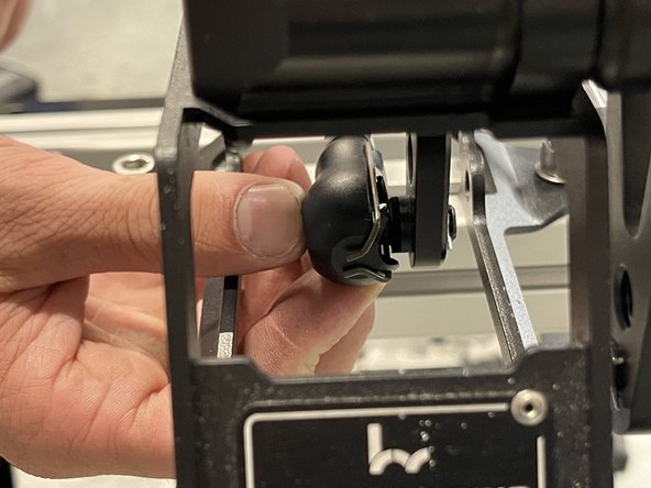 Under the shifter, slide the cable onto the ball. Make sure it clips into place and does not slide off.