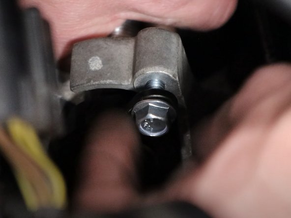 Use the supplied hardware and bolt the shifter cables to the transmission bracket.