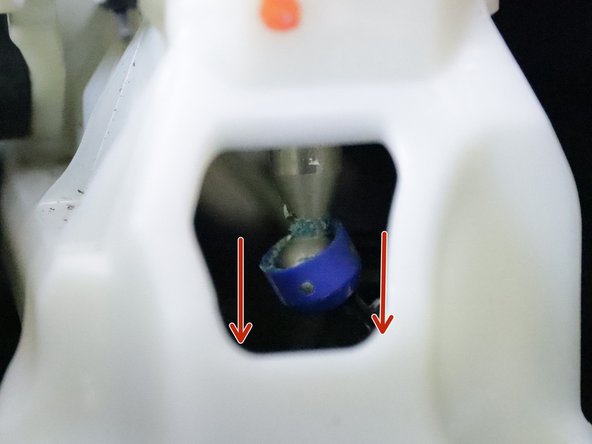 Remove the shifter cable from the shifter by spreading the metal clip apart and pulling it away from the shifter.