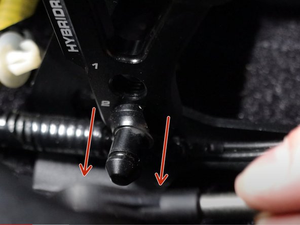 Remove the cotter pin from the right side shifter cable and slide it off the shifter pin. This cable should be completely free of the shifter.
