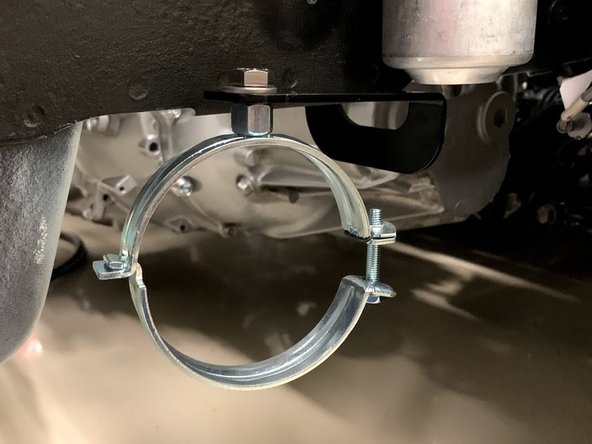 Using the supplied hardware, bolt the bracket to the threaded hole in the frame.