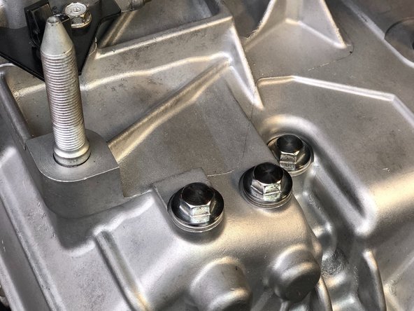 Remove each of the three gear selector detent springs. On the K-Series transmission, they are located on the top of the trans case.