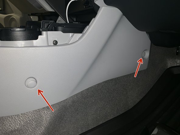 Remove the console clips. There are two on each of the front sides.