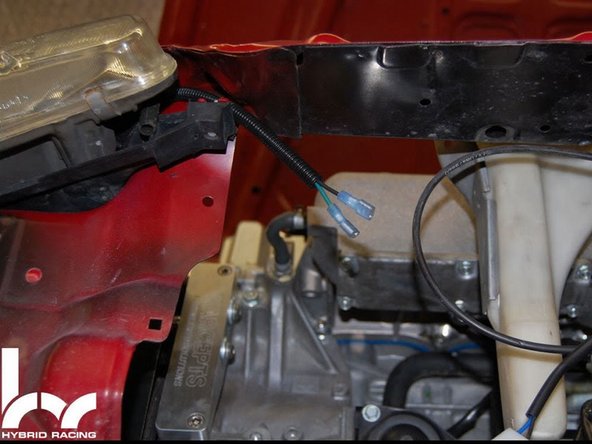 Locate the factory fan connector located near the stock OE radiator fan was. The easiest way to connect the fan is to use the crimp on connectors, remove the stock plug and crimp on the wire connector ends.