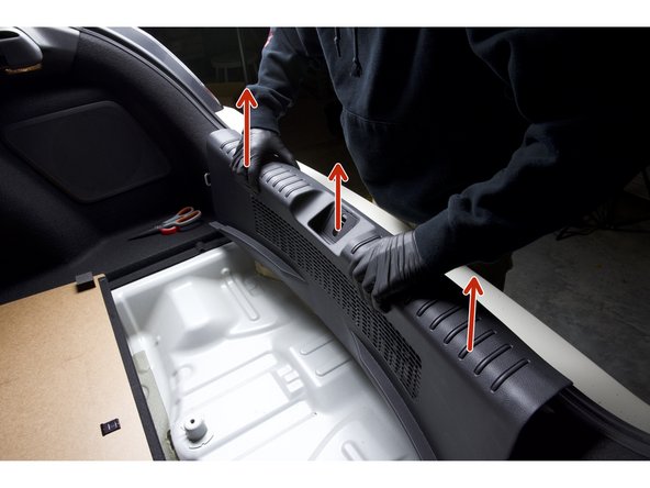 Pull upward on the rear plastic panel to remove it. Once removed, set aside.