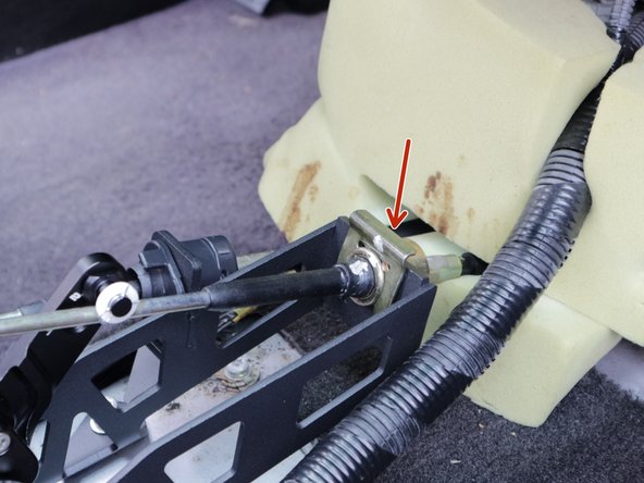 Rotate the left side cable and slide it into place. Rotate it counter clockwise to lock it into the shifter. It should not slide out.