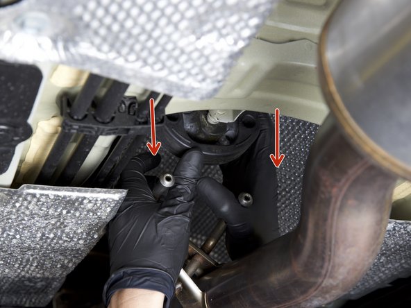 Disconnect the middle exhaust hanger.