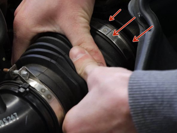 Slide the tube off the side of the airbox lid.