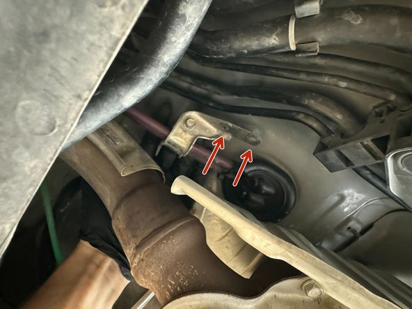 Use 10mm Socket to remove x2 Nuts from Shifter Cable Mount