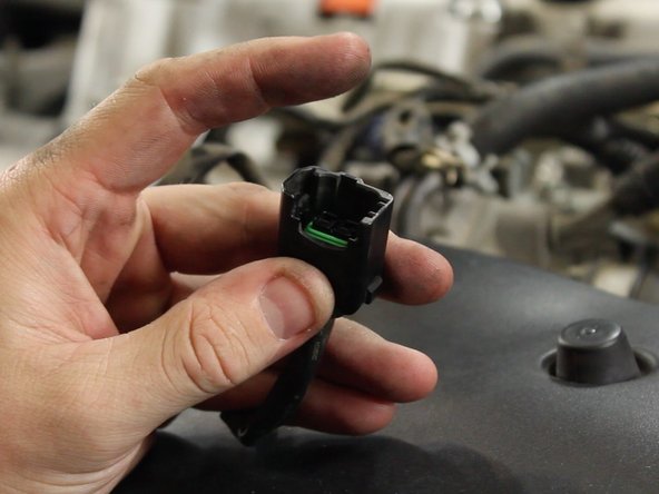 Using a small flat tip screw driver or pick tool, remove the pin lock inside of the OEM fuel injector connectors. (qty 4)