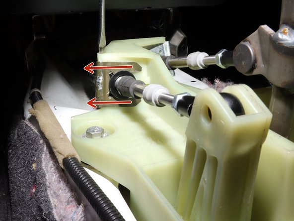 Remove the spring clip holding the cable in place.