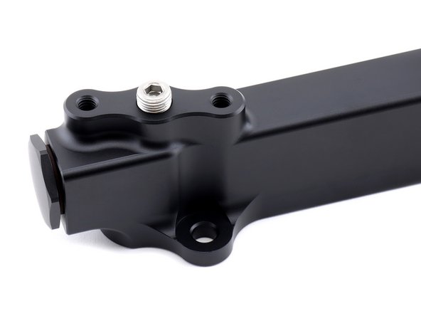 The port above the HR logo is intended to be used with the OEM Honda B-Series fuel pressure regulator.