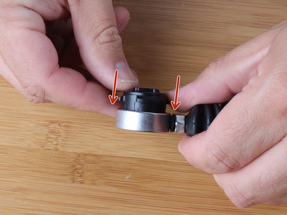 Be sure to align it correctly, squeez the tabs and slide the bushing into the cable end.