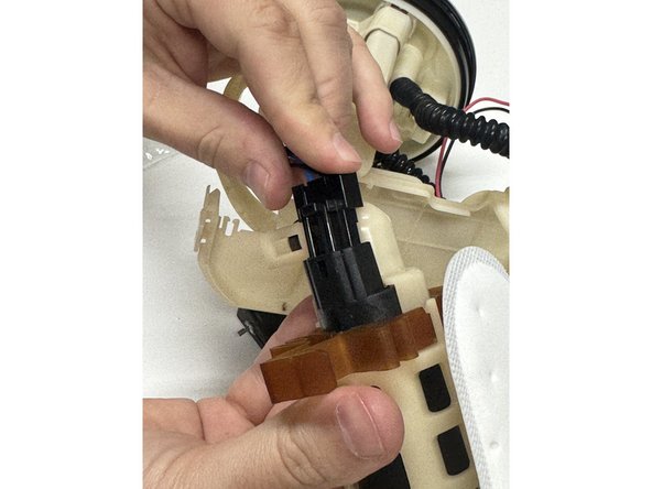 Plug the connector back into the fuel pump.
