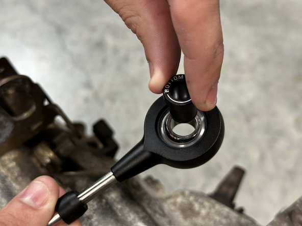 The TOP of the bushing contains the Hybrid Racing logo etching. This faces UP.