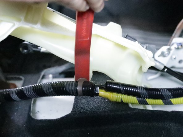 Use a pry tool and remove the wiring harness from the shifter.