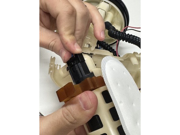 Plug the connector back into the fuel pump.