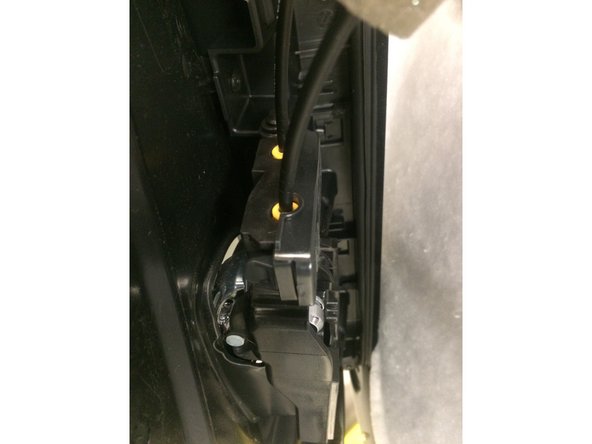 To disengage the clips, take a wider interior panel removal tool and pry along the bottom of the door panel.