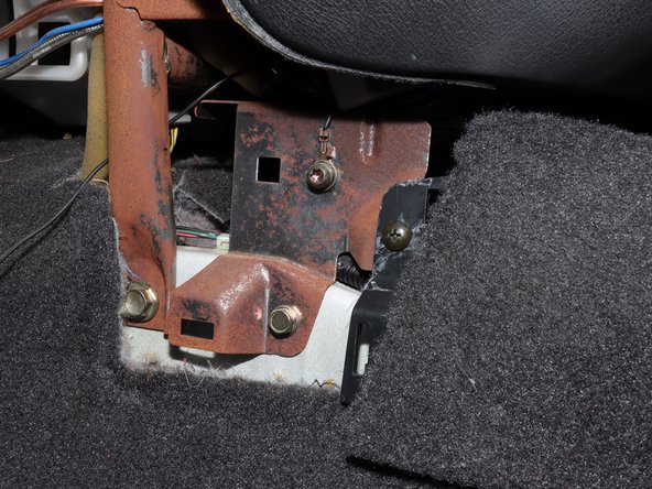 Remove the Phillips screw.