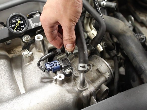 Remove the 10mm bolt mounting the MAP sensor harness mounting bracket.