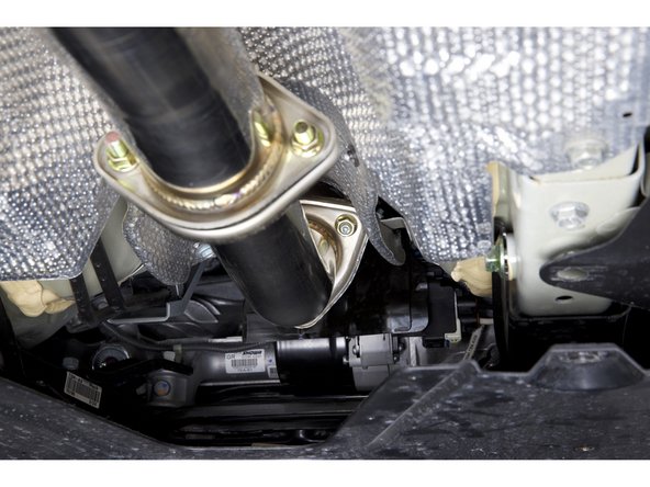 Use the supplied hardware and install the front pipe adapter.