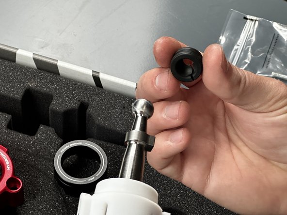 Locate the Shifter Ball Cup (#7) and snap it in place. This part should spin smoothly and freely.