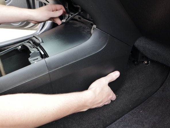 Use your hands and pry the center console apart. It will pop off with a little force.