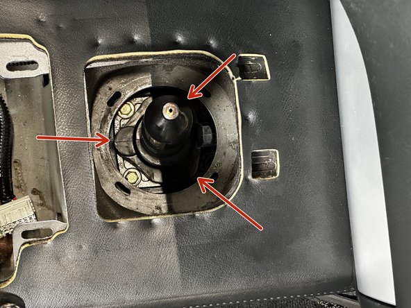 Use a 10mm socket and ratcher to unbolt and remove the shifter mounting bolts.