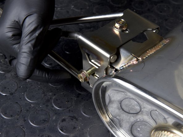 Locate and install the rear muffler brackets with the supplied hardware. Thread both sides together and be sure to keep them loose so the system can be adjusted once on the car.